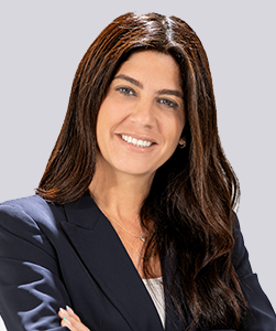 Smiling woman in professional attire.