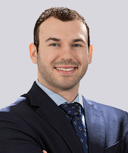 Man in suit smiling at camera